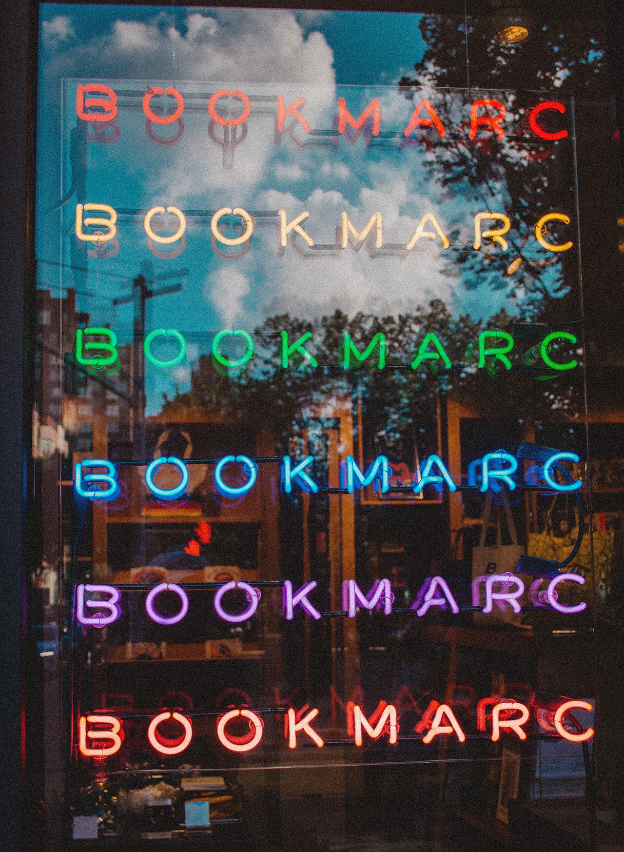 Exterior view of a shop with neon signage