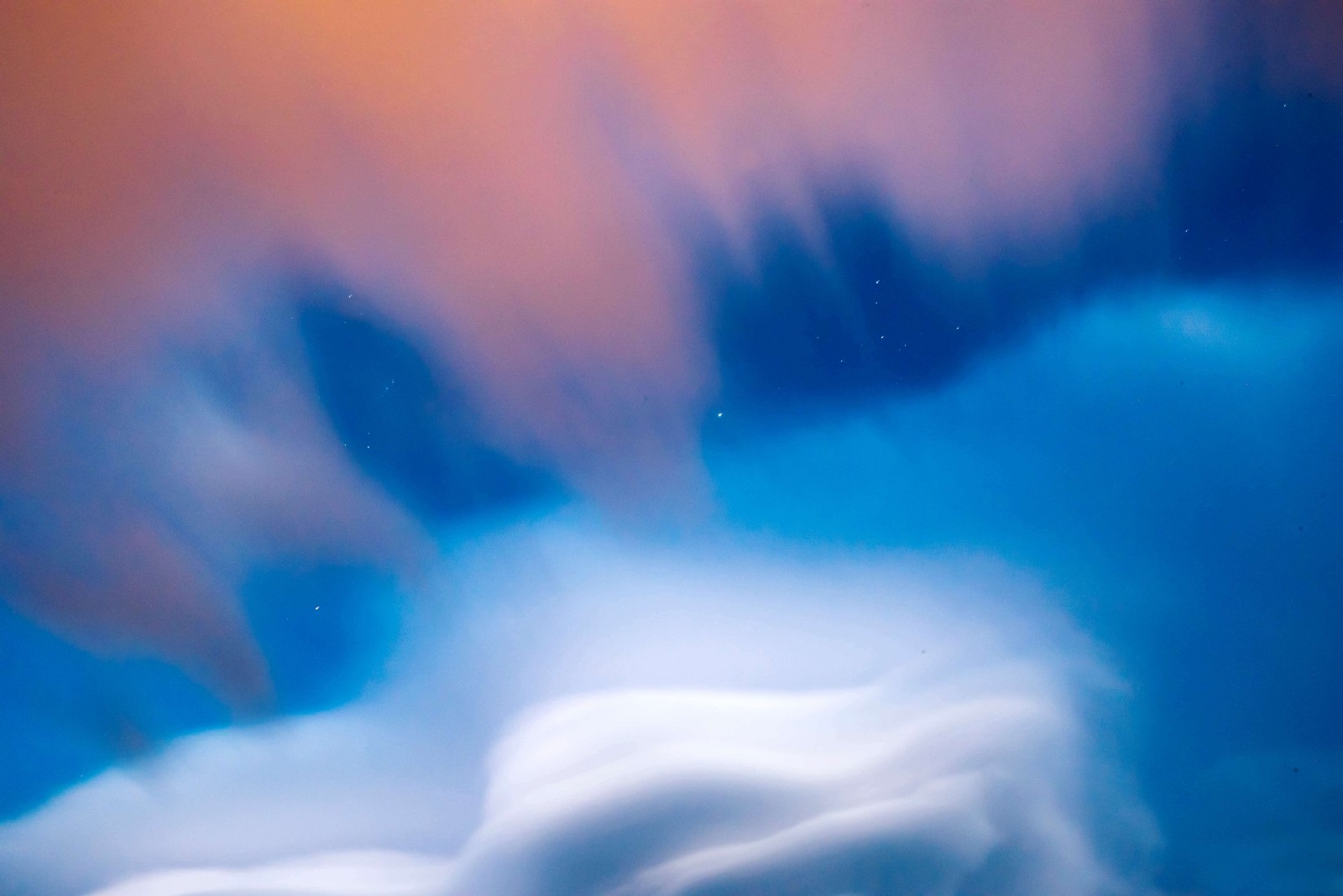 Blue sky with white and orange clouds