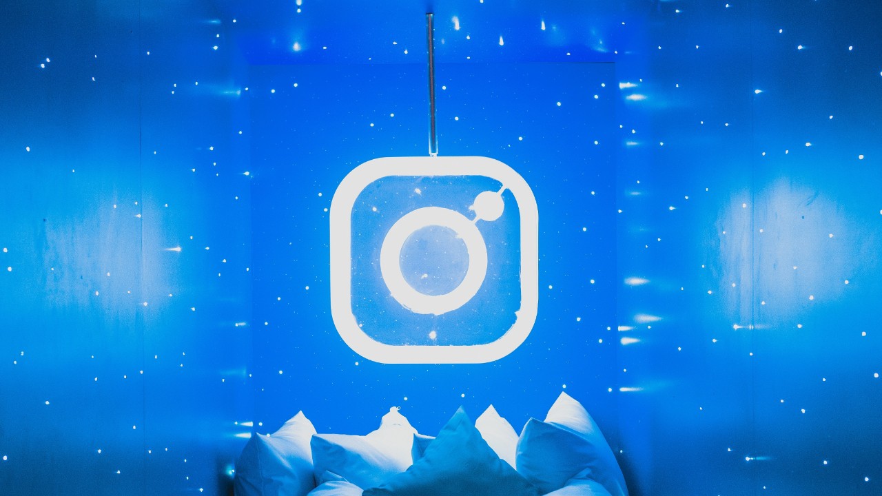 Instagram logo in a room with bright blue lights